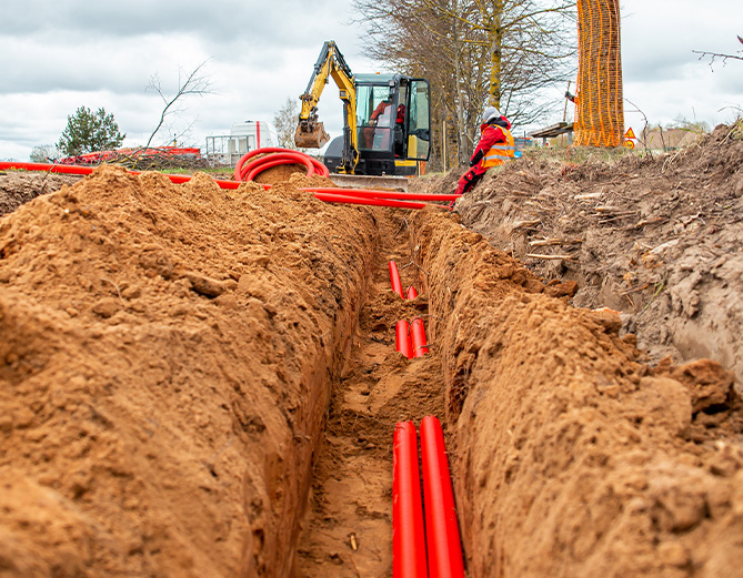 Conduit being placed in the ground